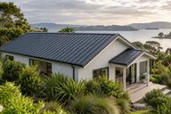 Illustrative home with a charcoal metal roof